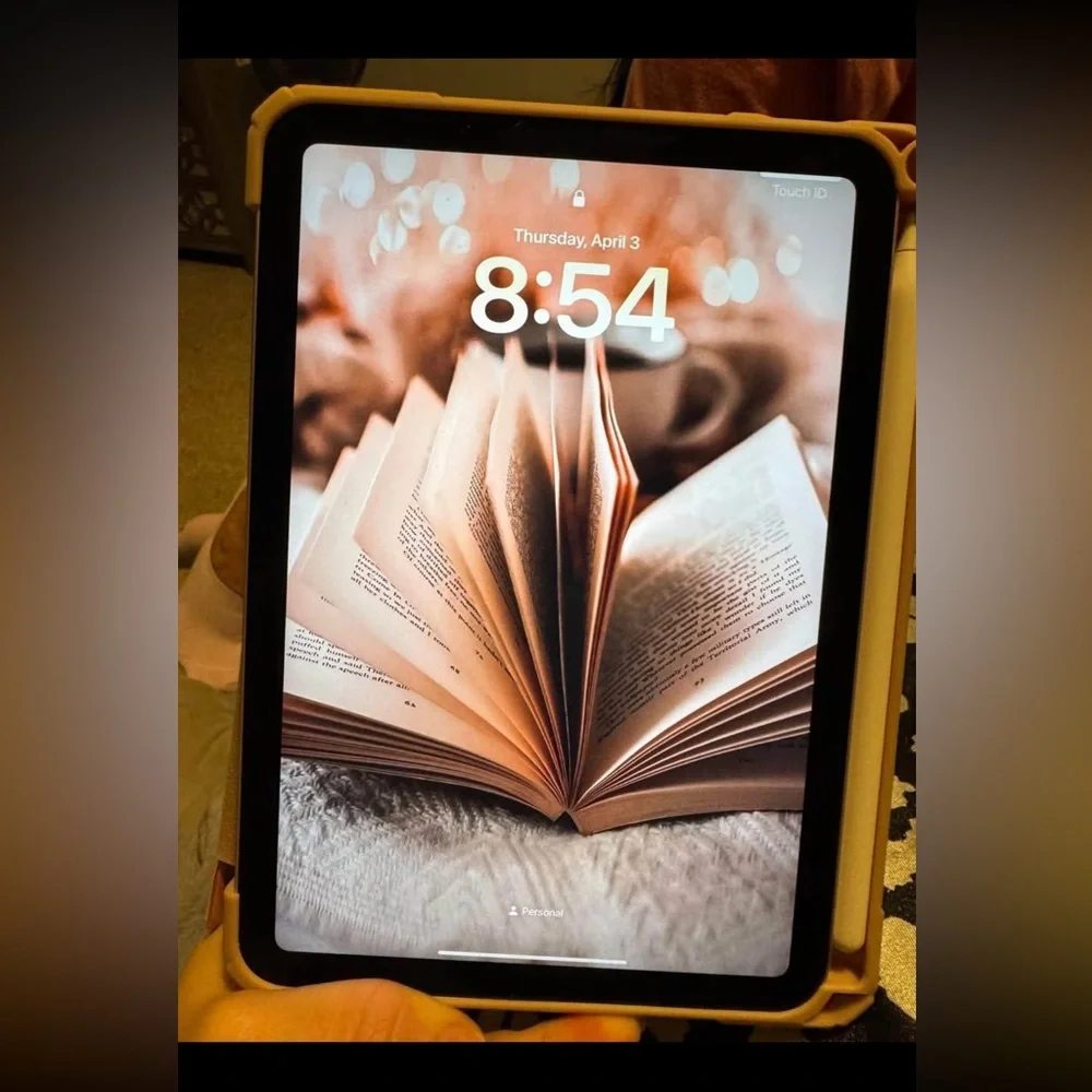 Tablet with Open Book Wallpaper